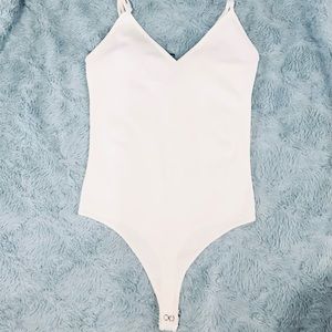 Ivory Spaghetti Strap V-neck Ribbed Bodysuit